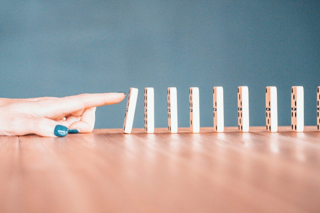 person holding white and blue plastic blocks