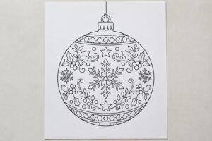 téléchargez et imprimez ce coloriage de boule de noël pour créer une décoration festive et ajouter une touche créative aux fêtes.